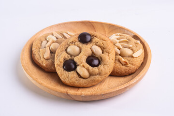 soft cookies with almond macadamia and chocolate on a table and plate