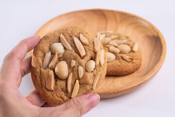 soft cookies with almond macadamia and chocolate on a table and plate