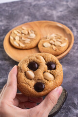 soft cookies with almond macadamia and chocolate on a table and plate