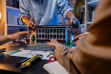 A diverse team of professionals shares ideas about architectural layouts and structural concepts, focusing on teamwork, creativity, and precision in modern engineering design discussions.