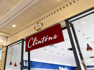 Naklejka premium Clintons store in Manchester mall interior with ornate ceiling and festive decor in UK