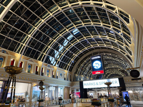 Manchester shopping arcade with glass vaulted ceiling and festive displays at Marks and Spencer