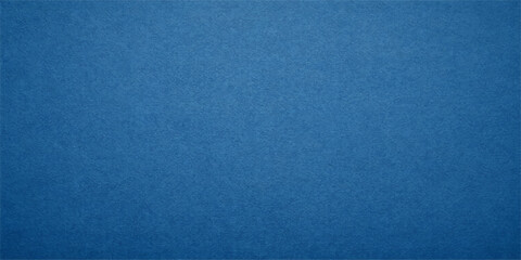 A dark blue vintage denim fabric texture with a rough canvas pattern and grunge textile material design creates a blank weathered wallpaper backdrop