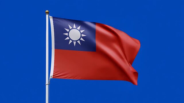 Taiwanese flag gracefully waving with patriotic pride against a plain blue screen background&nbsp;symbolizing freedom and national identity