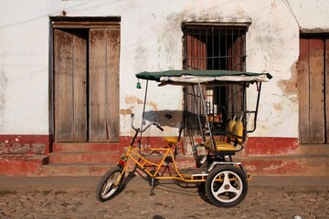 Poverty in Cuba. Tricycle taxi in Trinidad, Cuba. Home made vehicle.