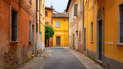 Obraz premium Charming Narrow Street in a Colorful Italian Village with Vibrant Walls and Calm Atmosphere Perfect for Travel and Lifestyle Photography