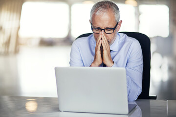 Laptop, prayer and mature man in office with stress, anxiety and brainstorming for business...