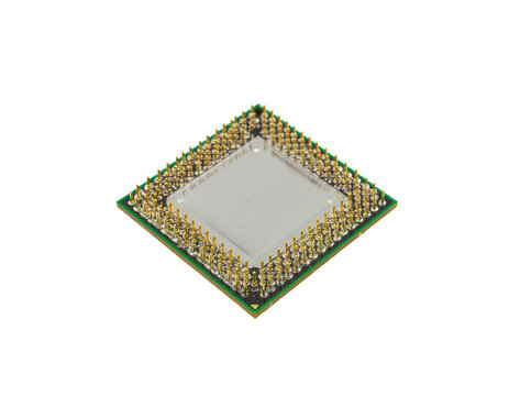Processor chip with gold pin grid array on green pcb showing intricate connectors