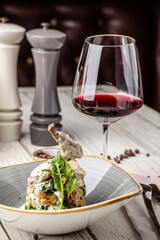 Creamy rabbit leg gourmet dinner with wine