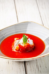 Modern tomato soup fine dining presentation