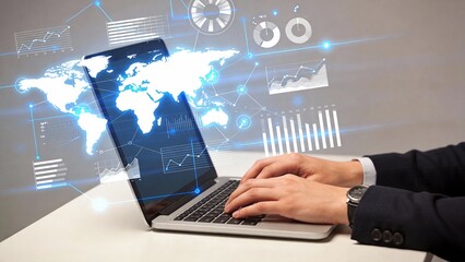 Person working on laptop with data visuals