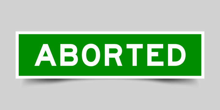 Green color square shape sticker label with word aborted on gray background