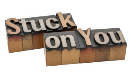 Stuck on you phrase in vintage wood type blocks for old school printing isolated on transparent background