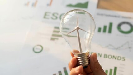 Sustainable investment strategies integrate ESG principles and AI technology for smarter investing decisions, promoting responsible growth with wind - Powered by Adobe