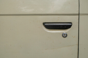 Close up of door handle and keyhole on a vintage car. For graphic design, banners and 3D rendering