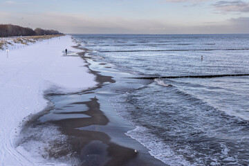 Winter walkers on the Baltic Sea coast of Usedom 