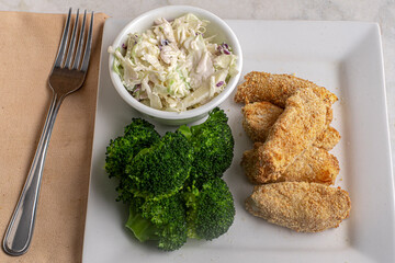 haddock bites  with broccoli and cole slaw
