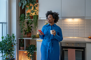 Relaxed dreamy african american woman take mindful break for stress free at home. Contented black...
