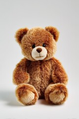 Fototapeta premium Cute brown teddy bear toy on a clean white backdrop for catalog use