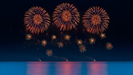 Vibrant fireworks display over water at night