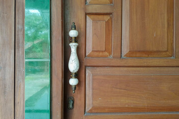 Close up of a classic white ceramic door handle. Vintage and unique door handle. For graphic design, 3D rendering and banners