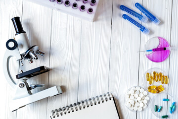 workplace lab assistant with microscope at the clinic top view