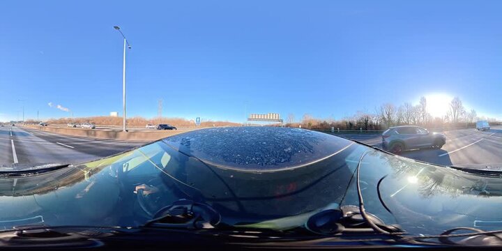 Car Travel on British Motorways During Sunny Day with Blue Sky over England. Car Top Roof Mounted Camera 360 Degree Panoramic Footage of British Road Travel and Traffic During Cold Sunny Day Drive