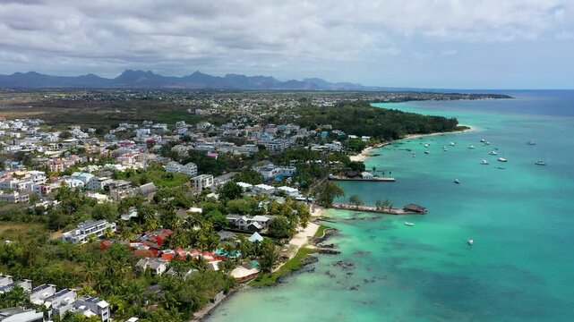Aerial view of beautiful beach in Trou aux Biches, Mauritius. Trou aux biches, public beach at Mauritius islands, Africa. Beach with palms and blue ocean. Amazing Trou aux Biches, Mauritius