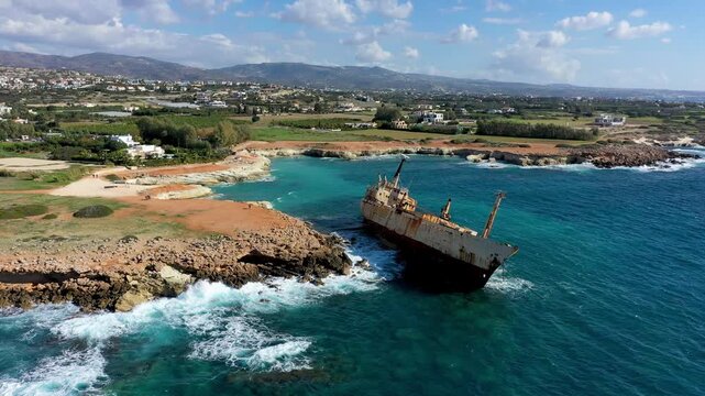 Abandoned Edro III Shipwreck at seashore of Peyia, near Paphos, Cyprus. Historic Edro III Shipwreck site on the shore of the water in Cyprus. Aerial view of Shipwreck EDRO III, Pegeia, Paphos.