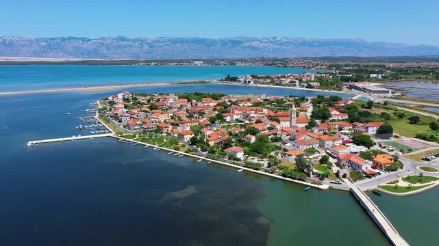 Historic town of Nin laguna aerial view with Velebit mountain background, Dalmatia region of Croatia. Aerial view of the famous Nin lagoon and medieval in Croatia