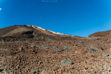 Volcanic landscape of Teide National Park, Tenerife, Spain. View on snowcapped Mount Teide.