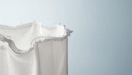 White Fabric with Ruffled Edge and Water Droplets on a Soft Background