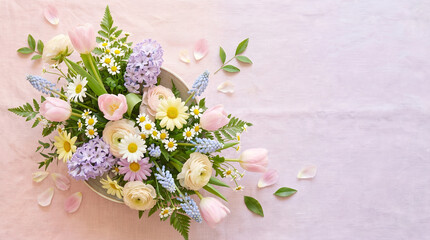 Soft pastel flower bouquet spring floral arrangement pink tulip white daisy ranunculus flower hyacinth blossom flat lay copy space romantic
