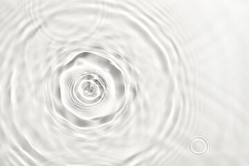 Water droplets creating ripples and waves on transparent background