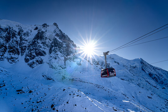 Cable car to summit of Aiguille du Midi mountain in French Alps in winter. Popular tourist attraction in Chamonix-Mont-Blanc.