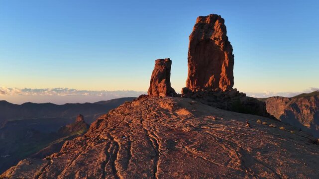 orbiting drone shot of iconic Roque Nublo in Gran Canaria at sunset, vacation in Gran Canaria, the Canary Islands, Spain, volcanic rock in Gran Canaria, hiking in the Canaries 