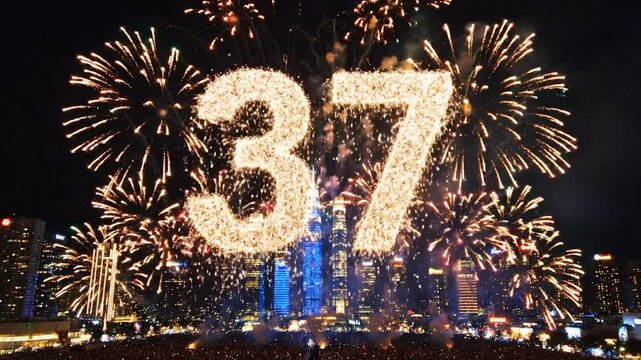 Fireworks Display Over Cityscape Celebrating 37th Anniversary