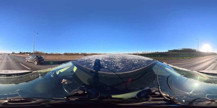 Car Travel on British Motorways During Sunny Day with Blue Sky over England. Car Top Roof Mounted Camera 360 Degree Panoramic Footage of British Road Travel and Traffic During Cold Sunny Day Drive.