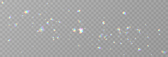 Falling holographic confetti. Shiny rainbow confetti PNG. Falling streamers or tinsel on an isolated transparent background. © Vitaliy