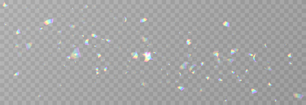Falling holographic confetti. Shiny rainbow confetti PNG. Falling streamers or tinsel on an isolated transparent background.