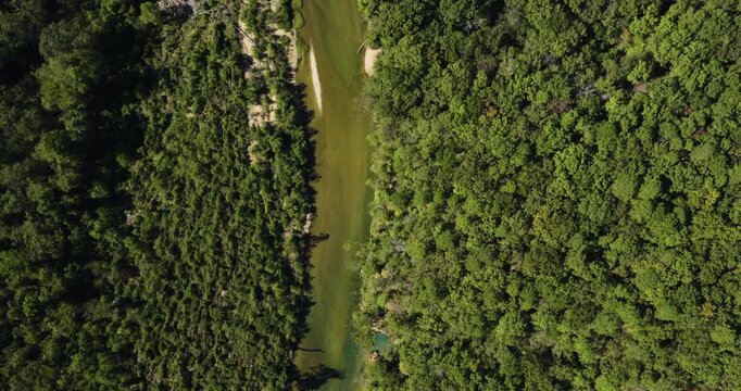 Aerial View Of North Fork River Winding Through Dense Forest Near Devils Backbone Wilderness In Missouri. topdown shot