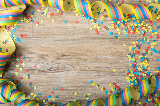 Colorful party frame with streamers and confetti