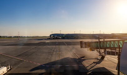 Passenger boarding bridge at the terminal gate of a modern international airport.