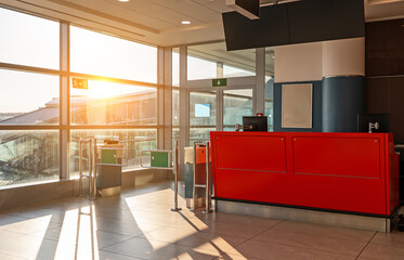 Modern check-in counter at an international airport boarding gate.