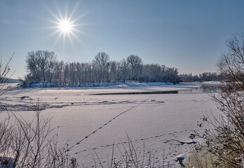 Frosty day by the river in winter.