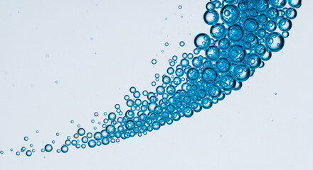 Close-up of blue bubble clusters against pale blue, creating wave shape, suggesting freshness, purity, and liquid movement, suited for water, cleanliness