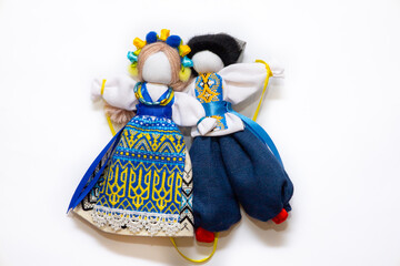 The Ukrainian motanka doll is an ancient amulet and symbol of Ukrainian culture, made without a face so as not to instill a soul in it. Instead of a face, a cross is often dangled to protect against e