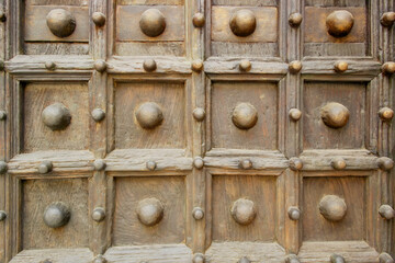 Background of an old wooden door with high relief decorations