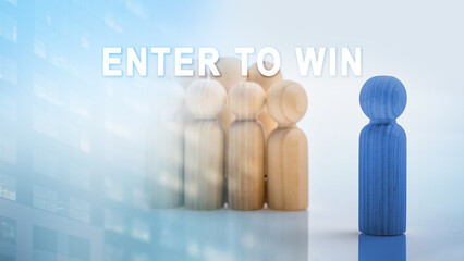 Wooden figure inviting others to "Enter to Win." Concept of online contest, giveaway, raffle, or lottery