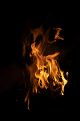 Fire texture on black background. Fire in the dark.